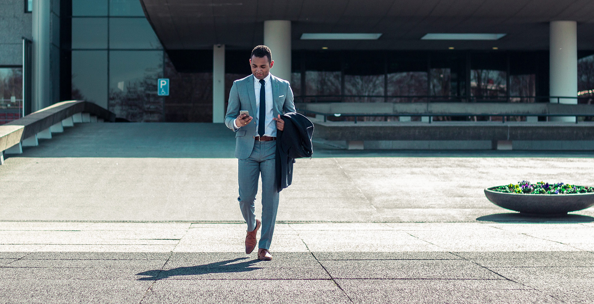 a man in a suit walking