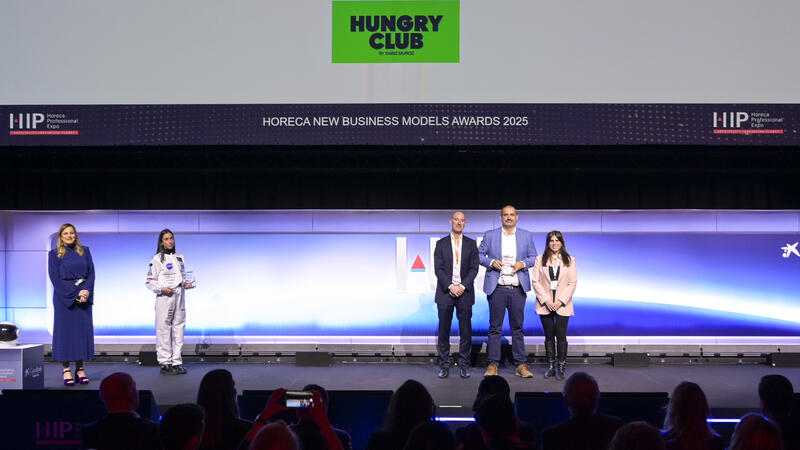 Avolta managers on the HIP Awards stage receiving an award 
