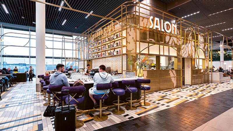 A bar with a counter with high stools.