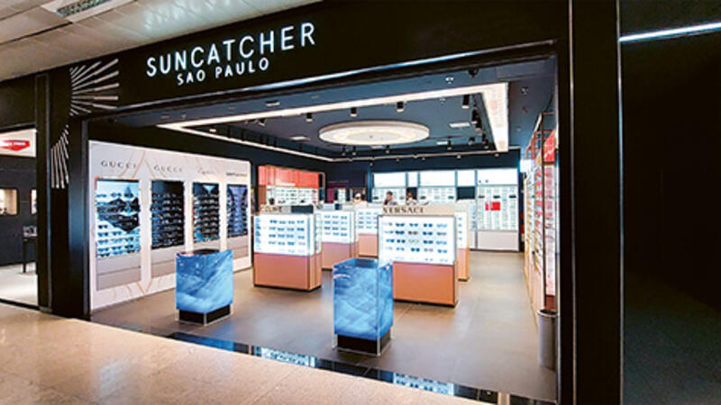 A store showcasing designer sunglasses displays.