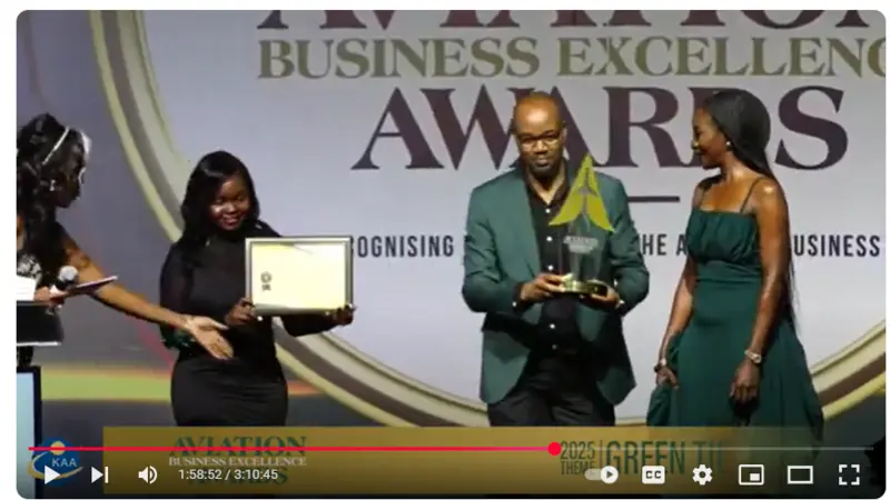 Two people receiving an award during a ceremony