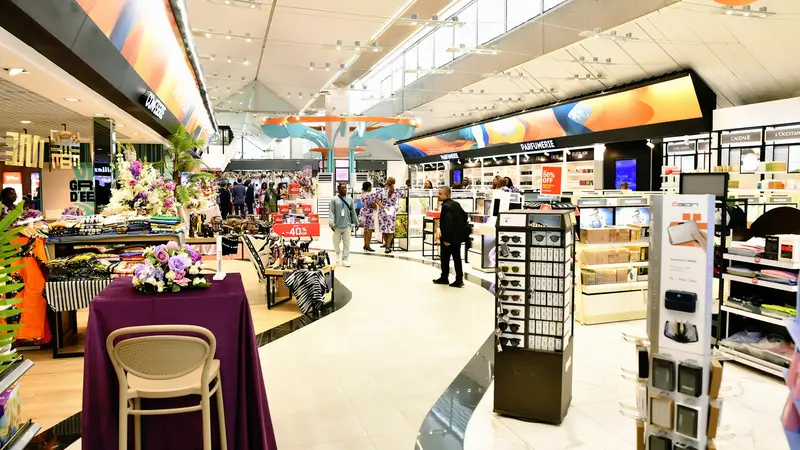 A duty free in an airport with shelves and diplays