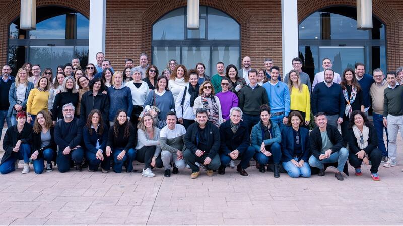 A grouo of people in front of an office