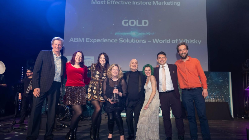 A group of people on a stage for an award