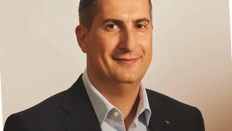 A man with black hair in a suit