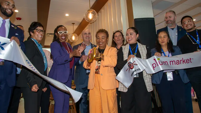 A team photo showing the celbratory ribbon cutting moment
