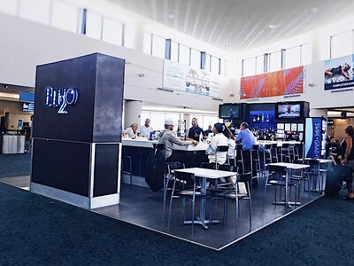 Entrance and tables of a BluO2 bar.