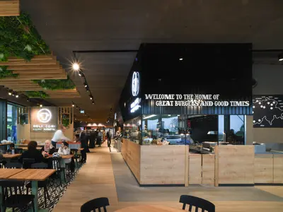 Tables and counter inside an Autogrill store on the motorway.