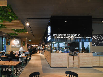 Tables and counter inside an Autogrill store on the motorway.