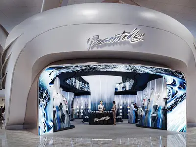 Presentedby store entrance with flowing sculptures and virtual digital simulations.