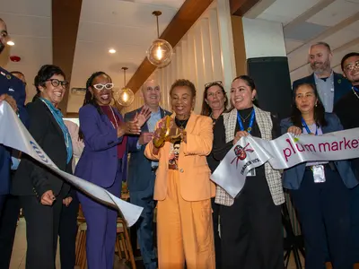 A team photo showing the celbratory ribbon cutting moment