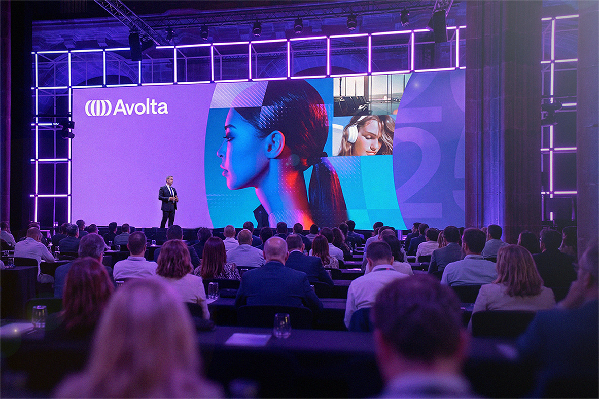 A man on a stage in front of an audience