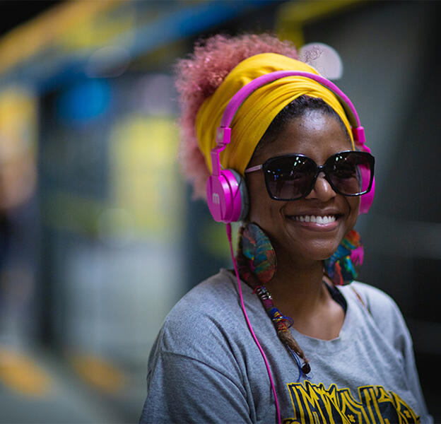 woman with headphones and sunglasses
