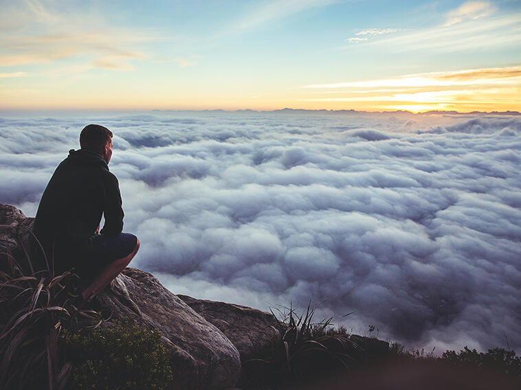 a man on top of a mountain