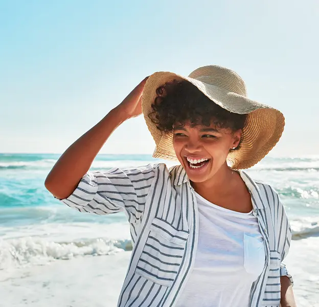 Women with hat on the beach